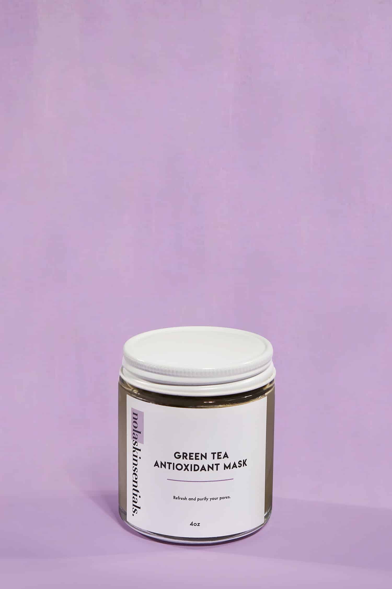A glass jar of green tea face mask. Used for refreshing skin with antioxidants.