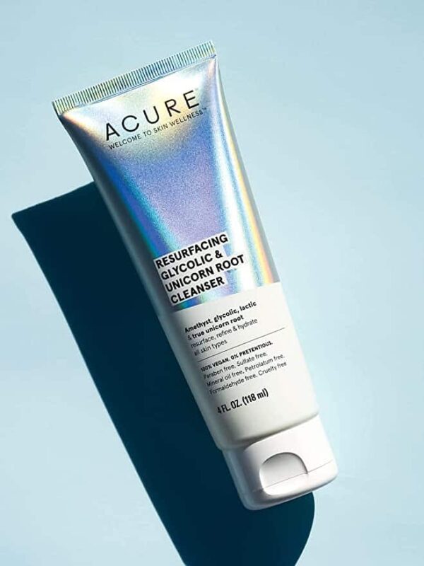 Acure Resurfacing Glycolic & Unicorn Root Natural Face Cleanser on a pale blue background.