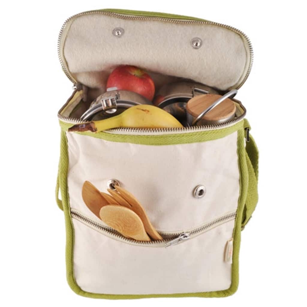 A cotton lunch bag that is tan with olive trim. It is full of food and wooden utensils.