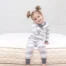 A photo of a young girl sitting on a Naturepedic Verse Organic Kids Mattress from Gimme the Good Stuff 008