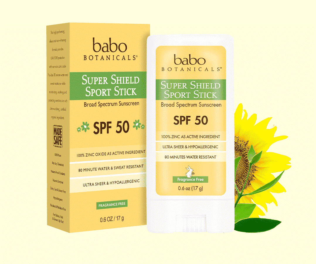 An image of Babo Botanicals Super Shield Mineral SPF 50 Fragrance Free Sunscreen Sport Stick with a sunflower on a yellow background.