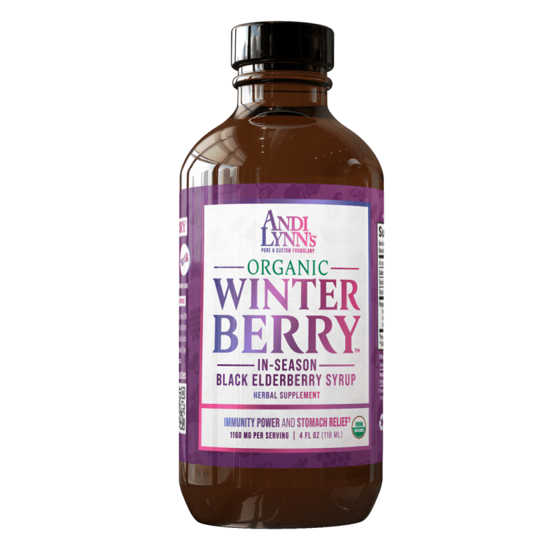 A dark purple glass bottle of black elderberry syrup for winter.